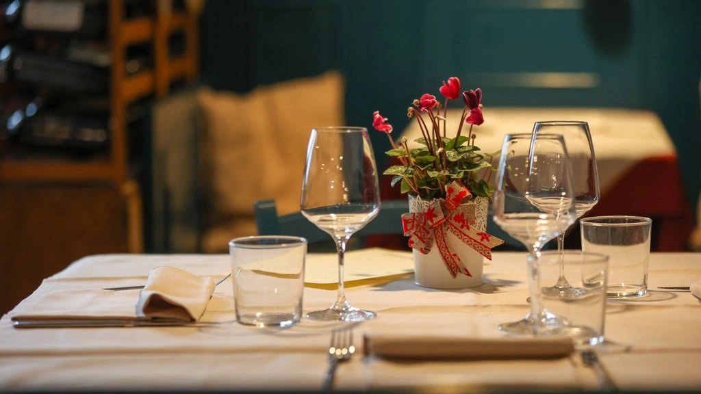The dining room at Hotel Mora's restaurant, lit by amber light at golden hour