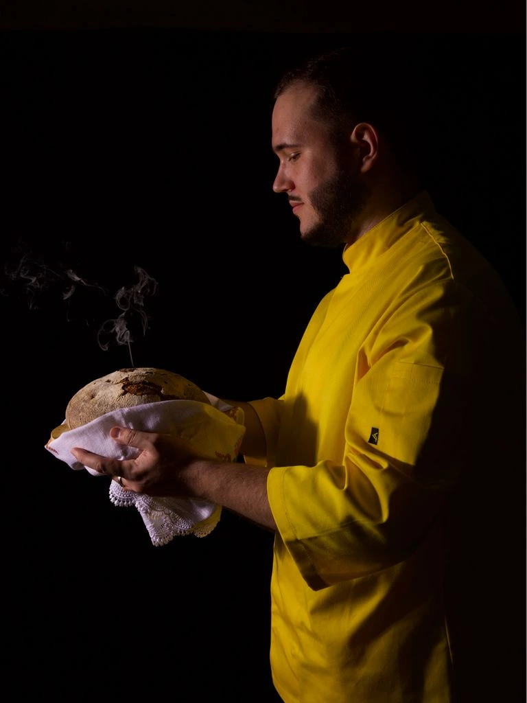 Chef Marco Bellini plating handmade pasta in the hotel kitchen